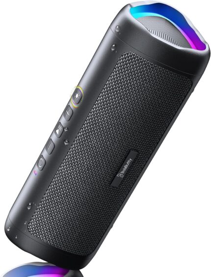 Black BolaButty portable Bluetooth speaker with colorful LED lights, shown outdoors on a picnic blanket.