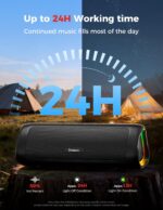 Black BolaButty portable Bluetooth speaker with colorful LED lights, shown outdoors on a picnic blanket.