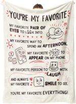 A beige Craftique "I Love You" flannel throw blanket, 60 by 50 inches, featuring romantic words and happy smile patterns.