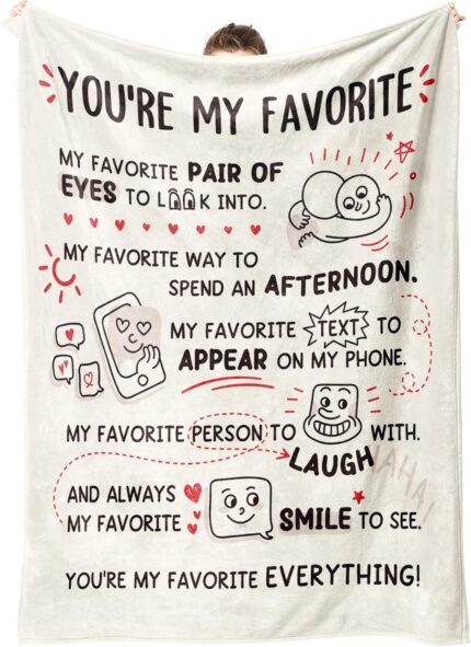A beige Craftique "I Love You" flannel throw blanket, 60 by 50 inches, featuring romantic words and happy smile patterns.