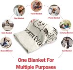 A beige Craftique "I Love You" flannel throw blanket, 60 by 50 inches, featuring romantic words and happy smile patterns.