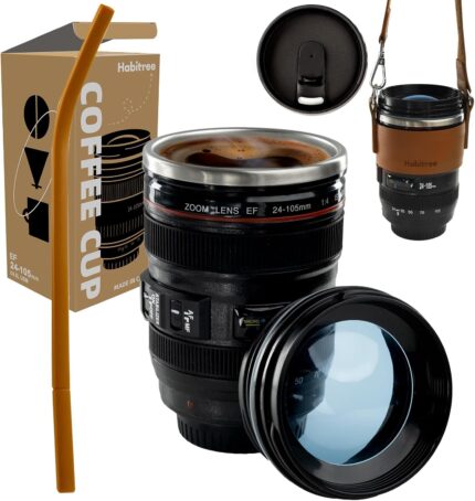 Black camera lens coffee mug with a cup sleeve and silicone straw, showcasing its unique design and accessories.
