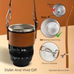 Black camera lens coffee mug with a cup sleeve and silicone straw, showcasing its unique design and accessories.