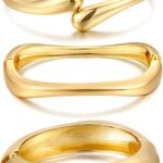 Three iF YOU chunky 14k gold plated bangle bracelets stacked on a woman's wrist, showing a radiant finish.