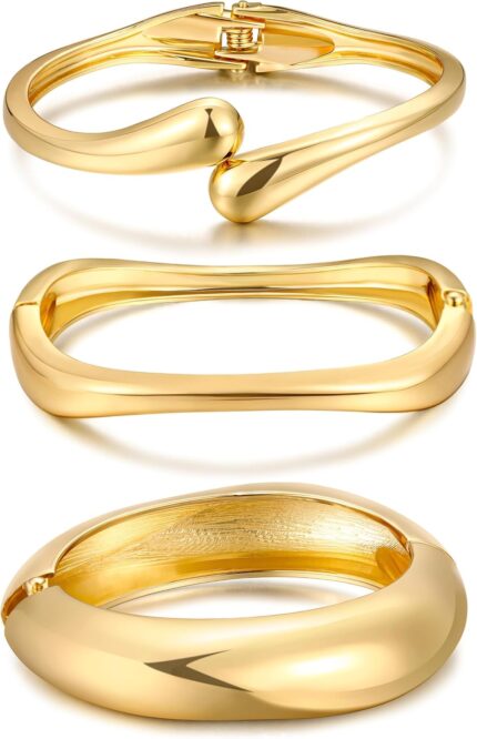 Three iF YOU chunky 14k gold plated bangle bracelets stacked on a woman's wrist, showing a radiant finish.