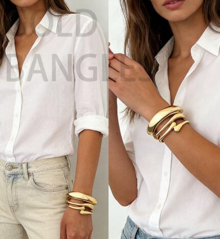 Three iF YOU chunky 14k gold plated bangle bracelets stacked on a woman's wrist, showing a radiant finish.