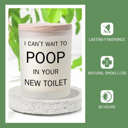 Frosted white jar candle with humorous text "I CAN'T WAIT TO POOP IN YOUR NEW TOILET" and a lit wick, on a neutral background
