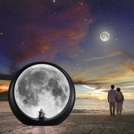 mamre Super Moon Lamp glowing softly, featuring a romantic couple silhouette under a full moon, with included decorative stic