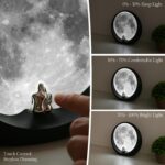 mamre Super Moon Lamp glowing softly, featuring a romantic couple silhouette under a full moon, with included decorative stic