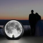 mamre Super Moon Lamp glowing softly, featuring a romantic couple silhouette under a full moon, with included decorative stic