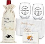 A YENCHORN housewarming gift basket featuring two round 15oz wine glasses, a wine bag, and a card inside a gift box.